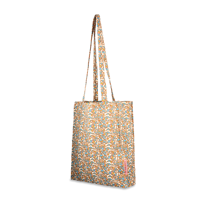 A multicolored geometric pattern tote bag with long handles.