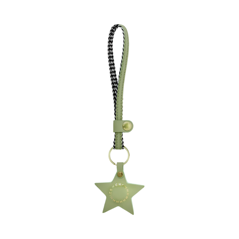 Green star-shaped keychain with a strap on a white background